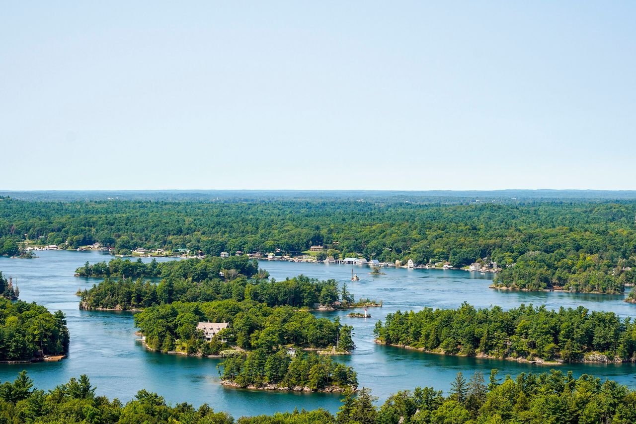 About Aerial view of Thousand Islands with lush green forests and shimmering water in Ontario, Canada.